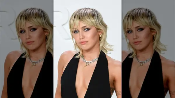 Miley Cyrus with a blonde mullet on the red carpet
