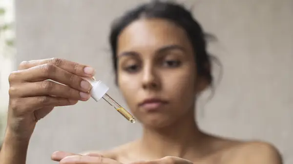 Woman applying skincare