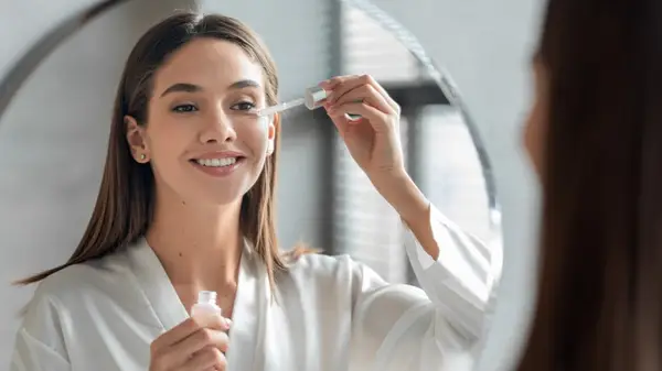 Woman applying skincare