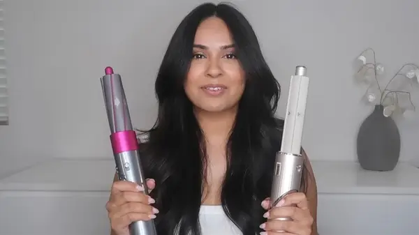 Woman holding Airwrap and a FlexStyle