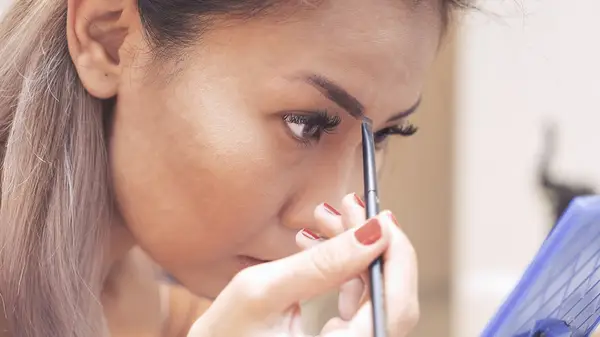 Doing eyebrow makeup