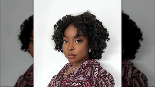 Woman with shorter curly hair