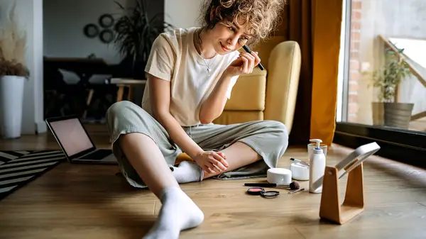 Woman applying eyeshadow