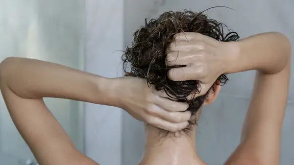 Massaging scalp