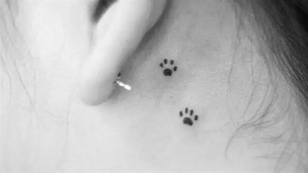 Paw prints tattoo