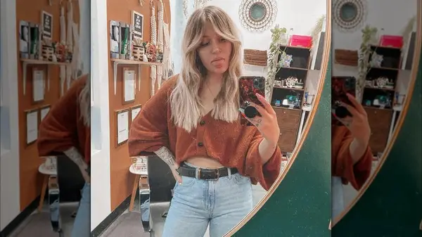 Woman with curtain bangs and shag haircut