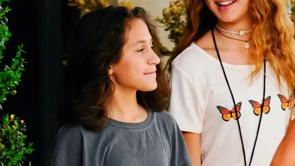 Emme Muniz with shoulder-length curls