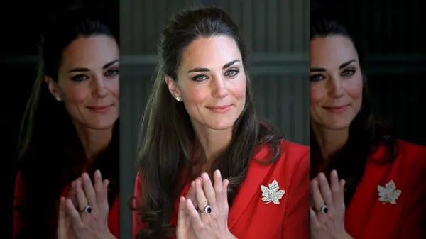 Kate Middleton smiling with her hair pulled back in a red top