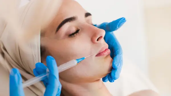 woman gets dermal filler injection