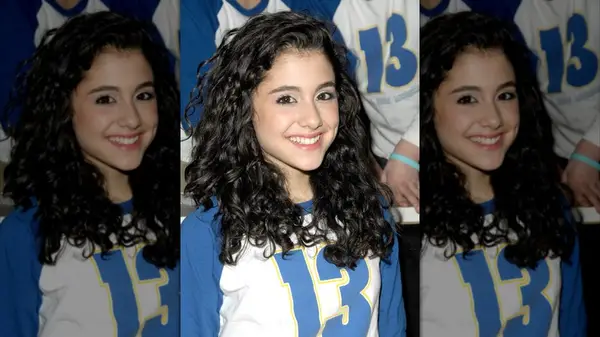 Ariana Grande with dark, curly hair smiling into the camera in 2008