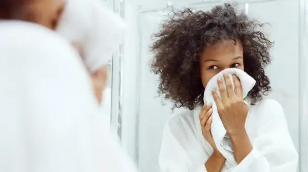 Woman washing her face