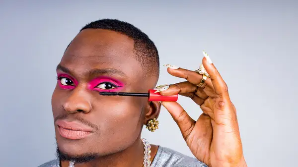 Person applying mascara