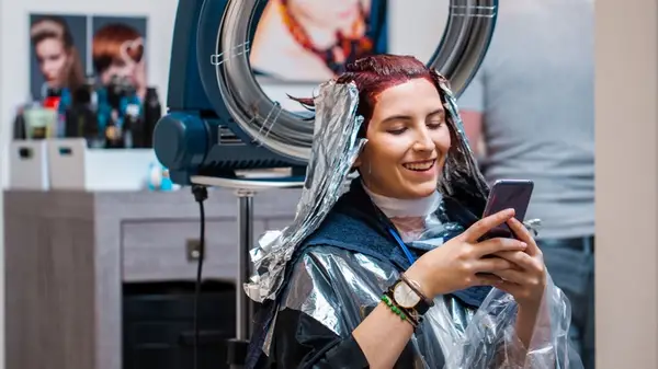 Woman having her hair dyed