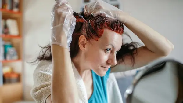 Woman dyeing her hair