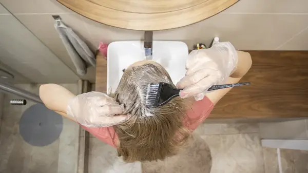 Person dyeing their hair