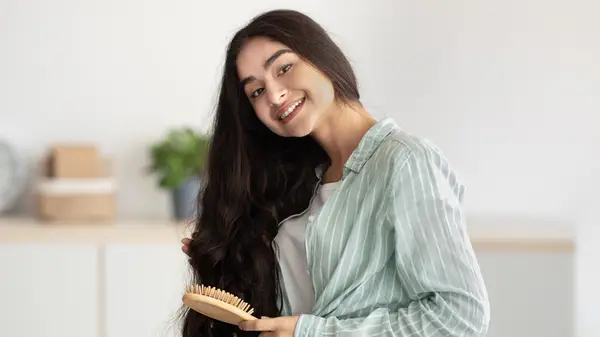 Woman brushing her hair