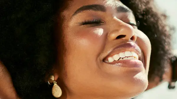 Woman smiling in sun