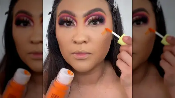 Applying orange blush