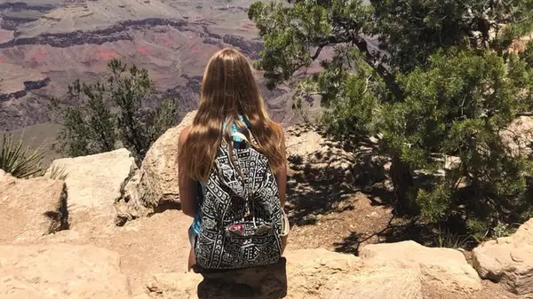 A woman wearing a Taaluma Totes bag