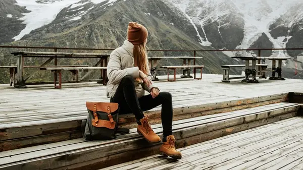 Woman backpacking in mountains