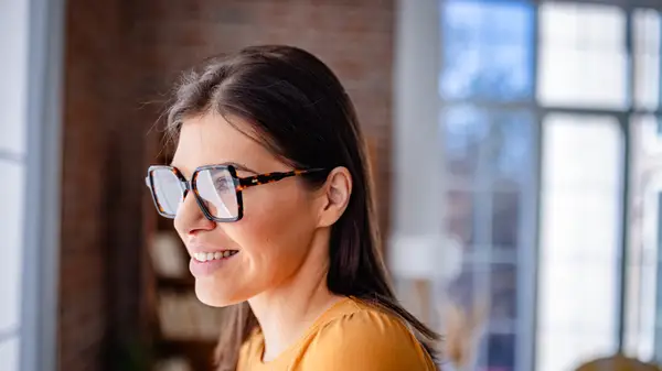 Woman wearing big glasses