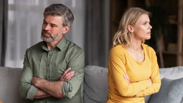 Couple turning away from one another