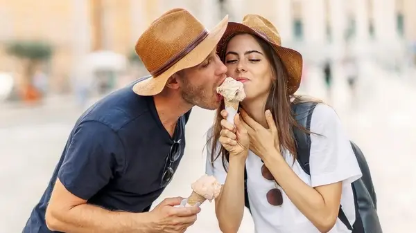 A couple sharing an ice cream