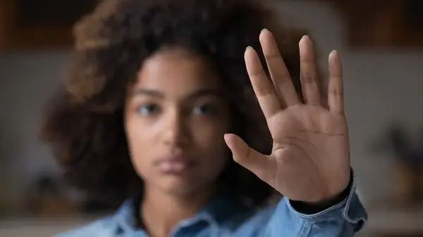 Woman with her hand up