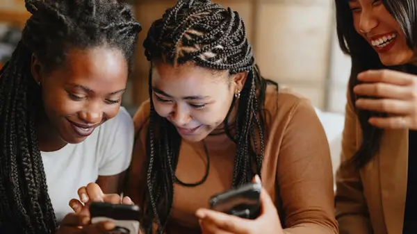 Women looking at phones