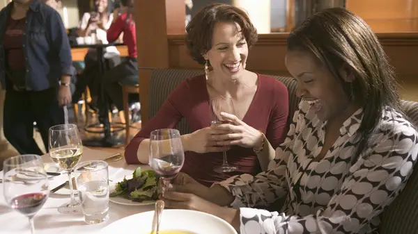 Two friends enjoying a meal