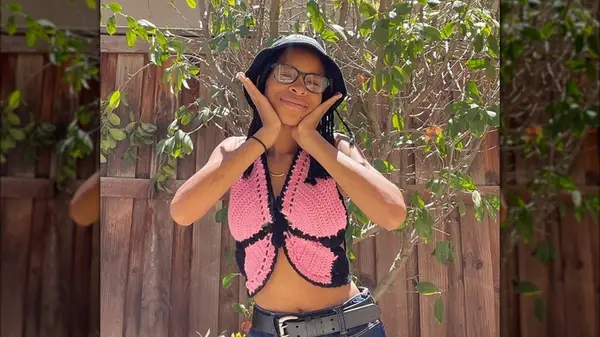 Woman in a crochet butterfly top