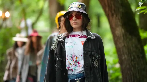 Woman wearing distressed bucket hat
