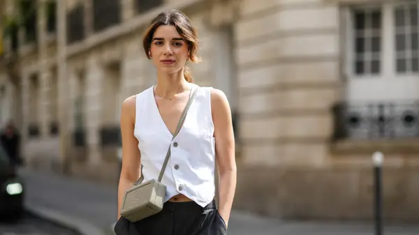 Woman wearing vest as top