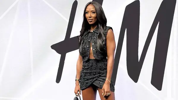 woman poses in black outfit