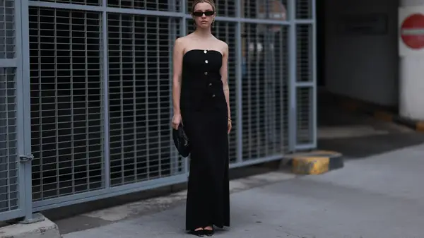 Woman in a long black skirt and top