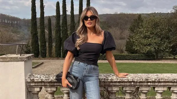 Woman wearing black linen top 