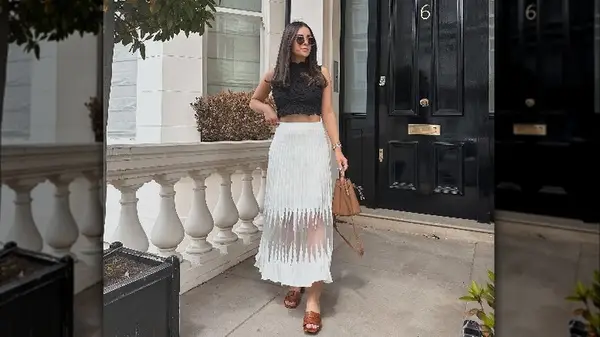 Woman wearing sheer maxi skirt