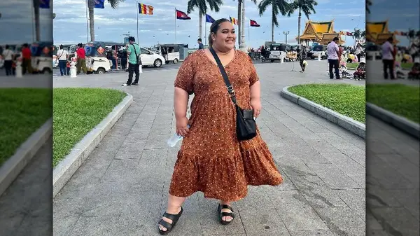 Woman smiling wearing maxi dress