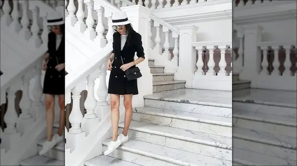 Woman wearing blazer dress & sneakers