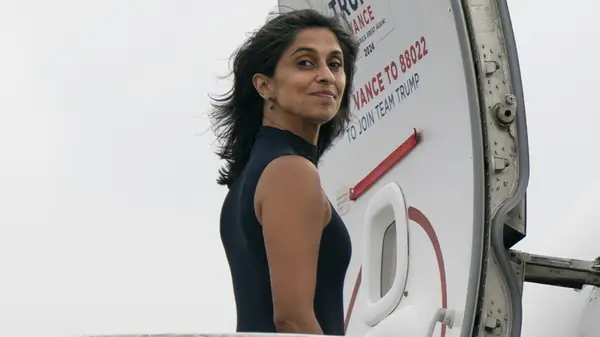 Usha Vance walks onto airplane