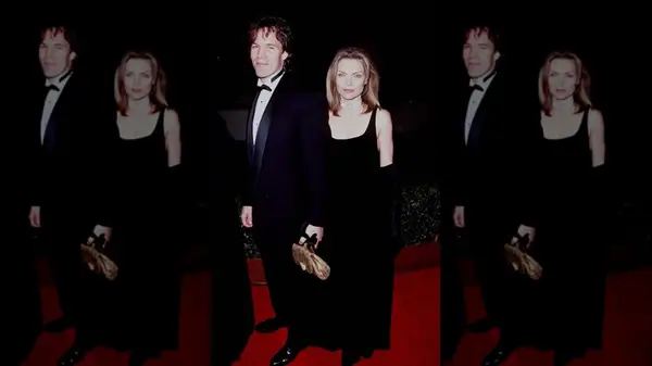 Michelle Pfeiffer on the red carpet in a black dress with a square neckline