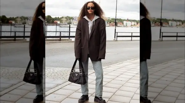 A woman in a brown blazer 