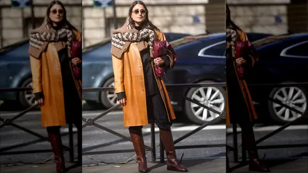 A woman in brown riding boots 