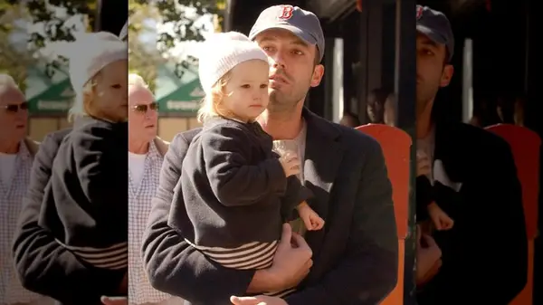 Ben Affleck holding daughter Violet Affleck in his arms as he walks down the streets of NYC