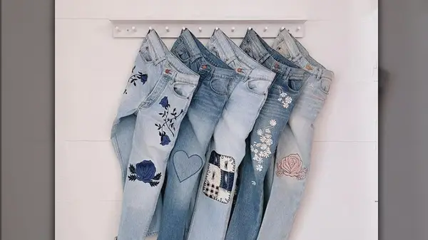 Four jeans on a hanger
