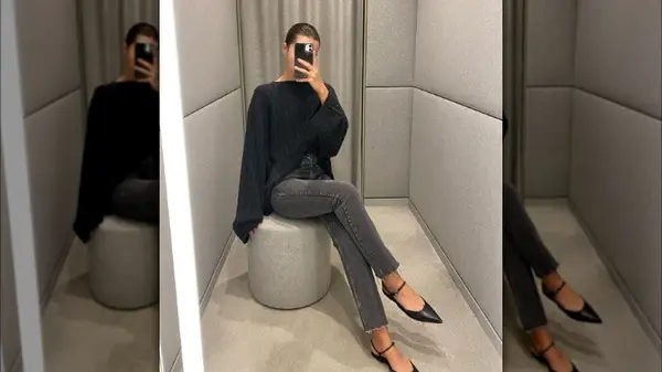 A woman taking a mirror selfie