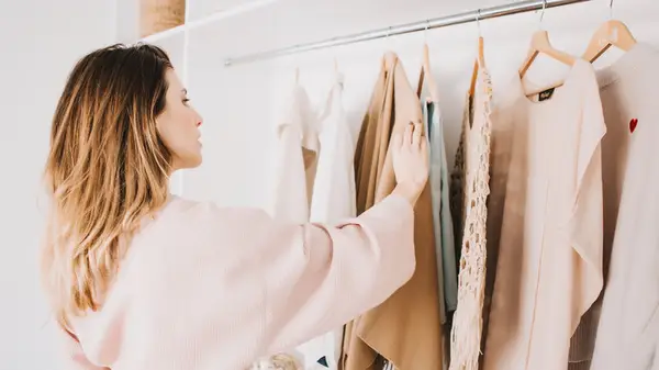 Woman looking through her closet