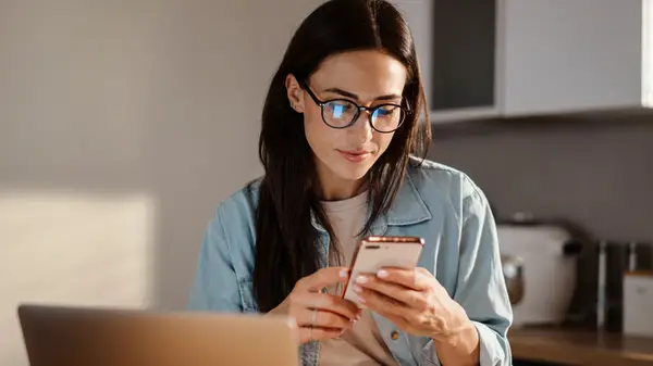 Woman on her laptop and her phone