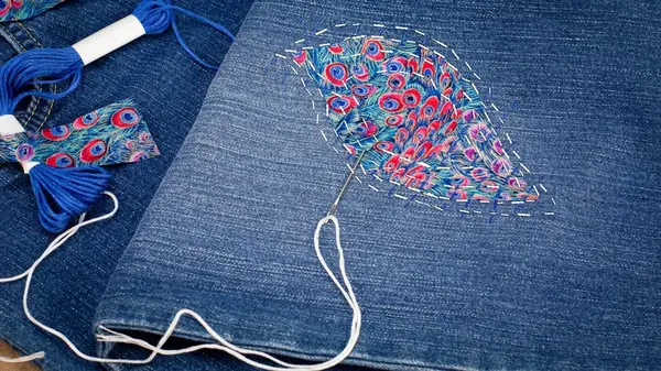 Visible mending on jeans