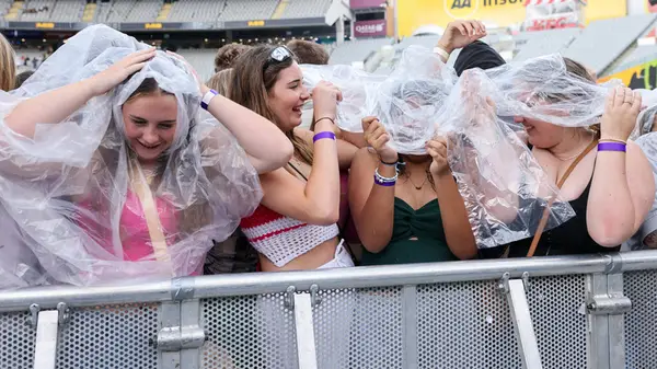 Girls at concert with ponchos